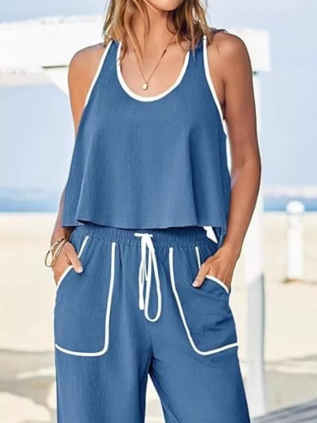 Two-piece tank and pants set with contrast trim, drawstring, and pockets.