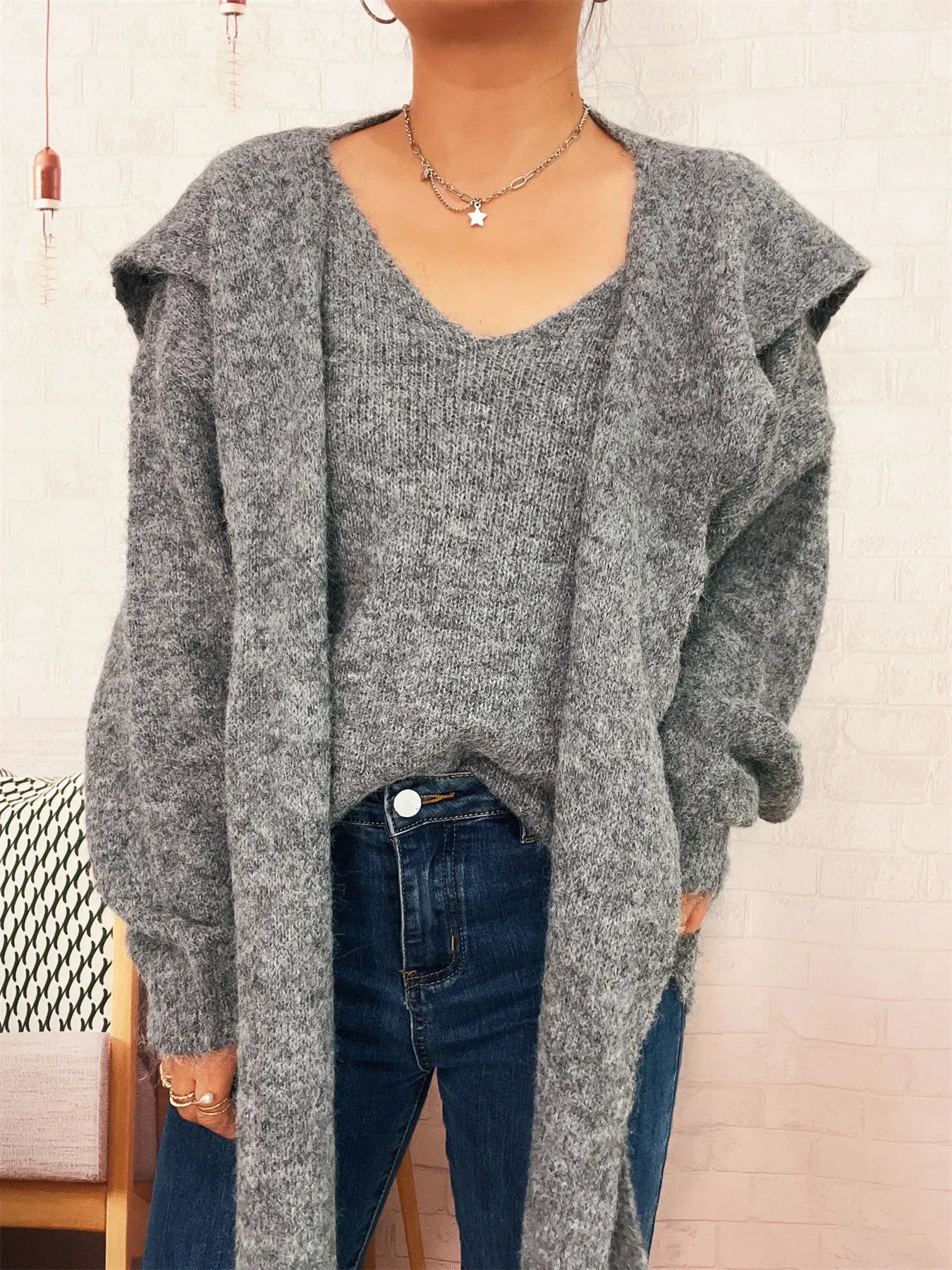 A ribbed hem V-neck sweater with a shawl collar in a basic style.
