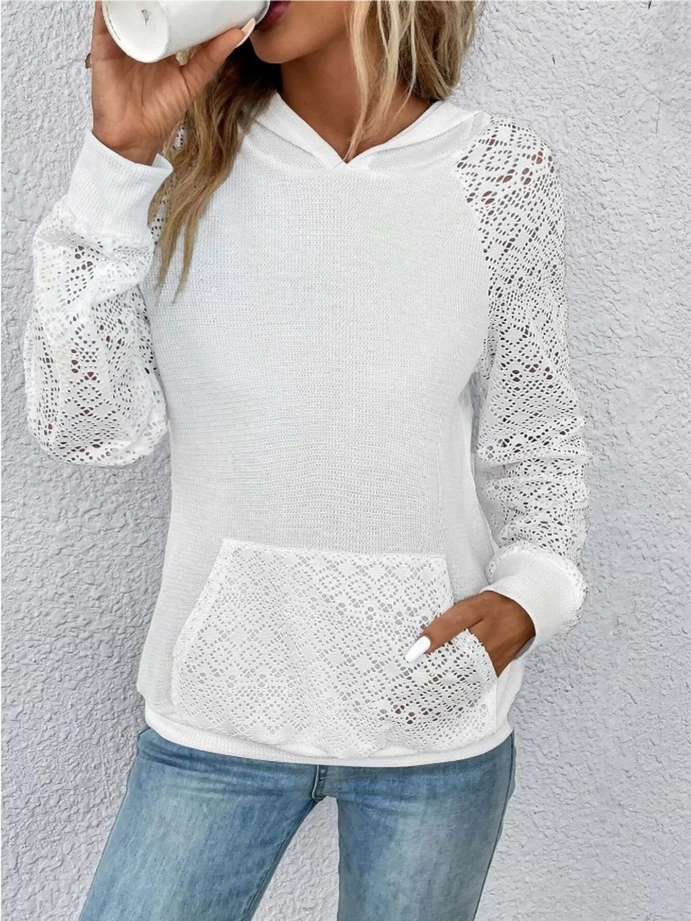 Light gray hoodie with lace sleeves and a kangaroo pocket made of stretchy polyester blend.
