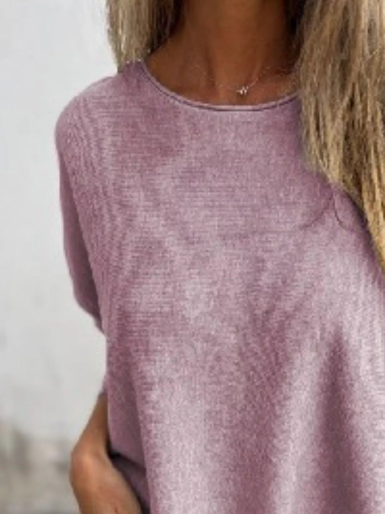 Plus size round neck long sleeve knit top in soft fabric with lace trim detail.