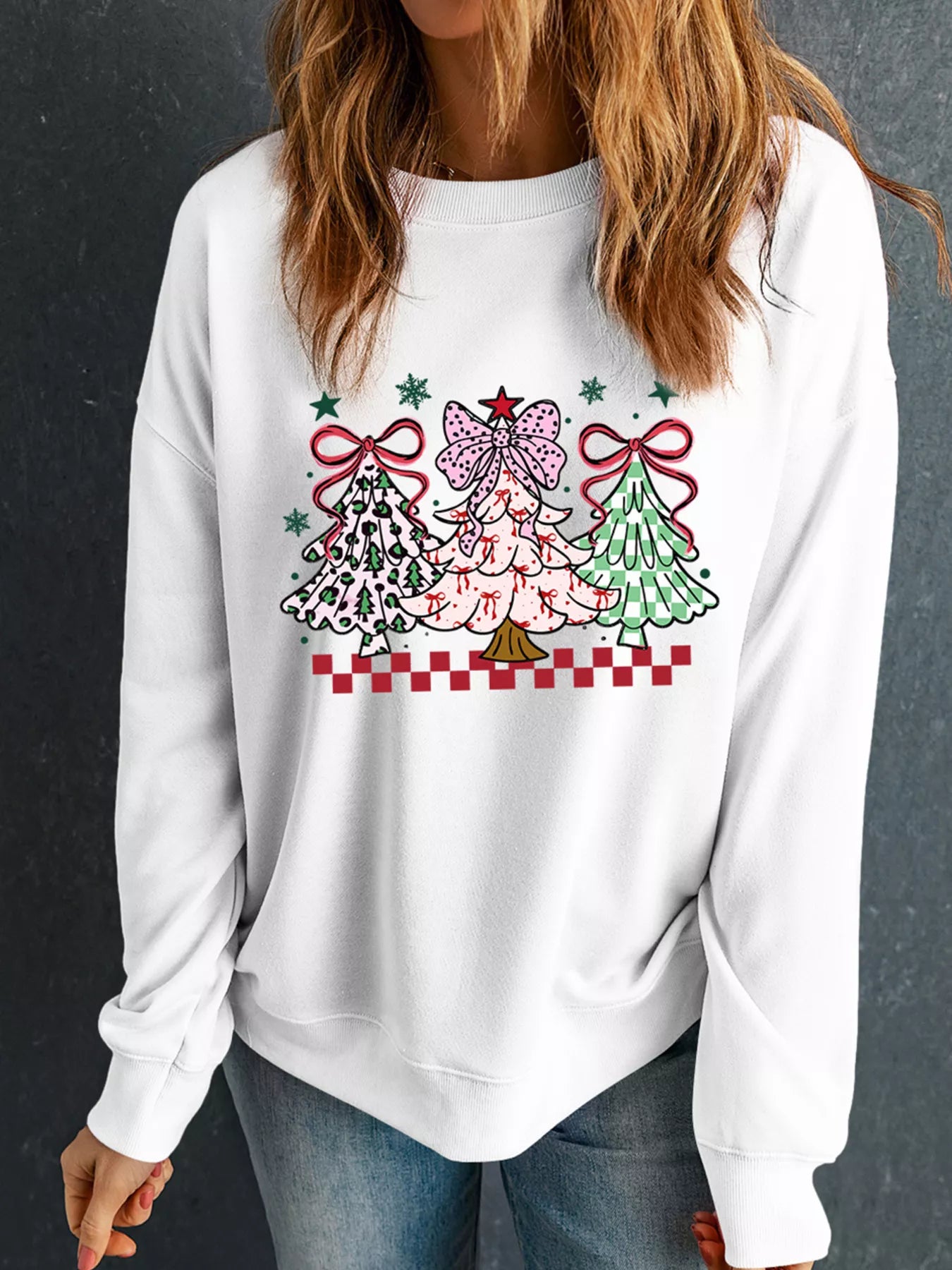 Gray sweatshirt featuring a Christmas tree graphic design on the front.