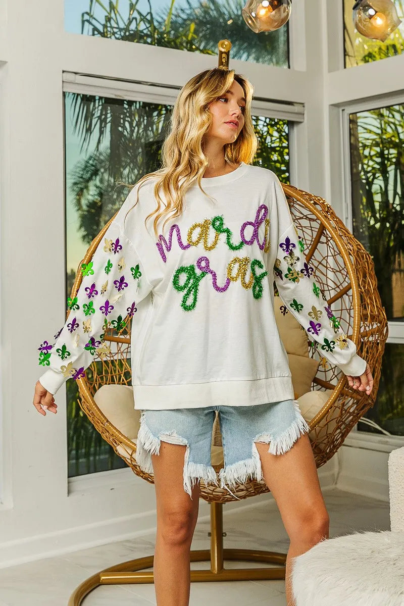Lightweight pullover with Fleur De Lis sleeve designs in soft-washed fabric for comfort.