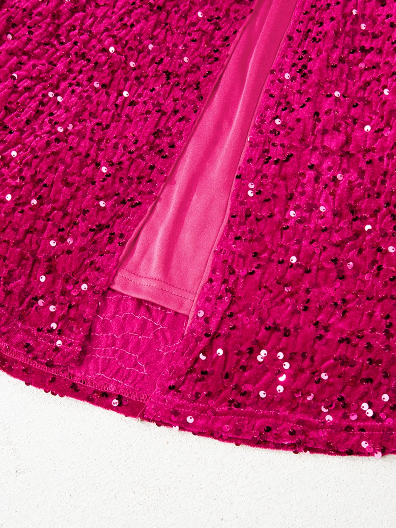 One-shoulder sequin dress in cotton spandex blend with a high slit for a stylish silhouette.