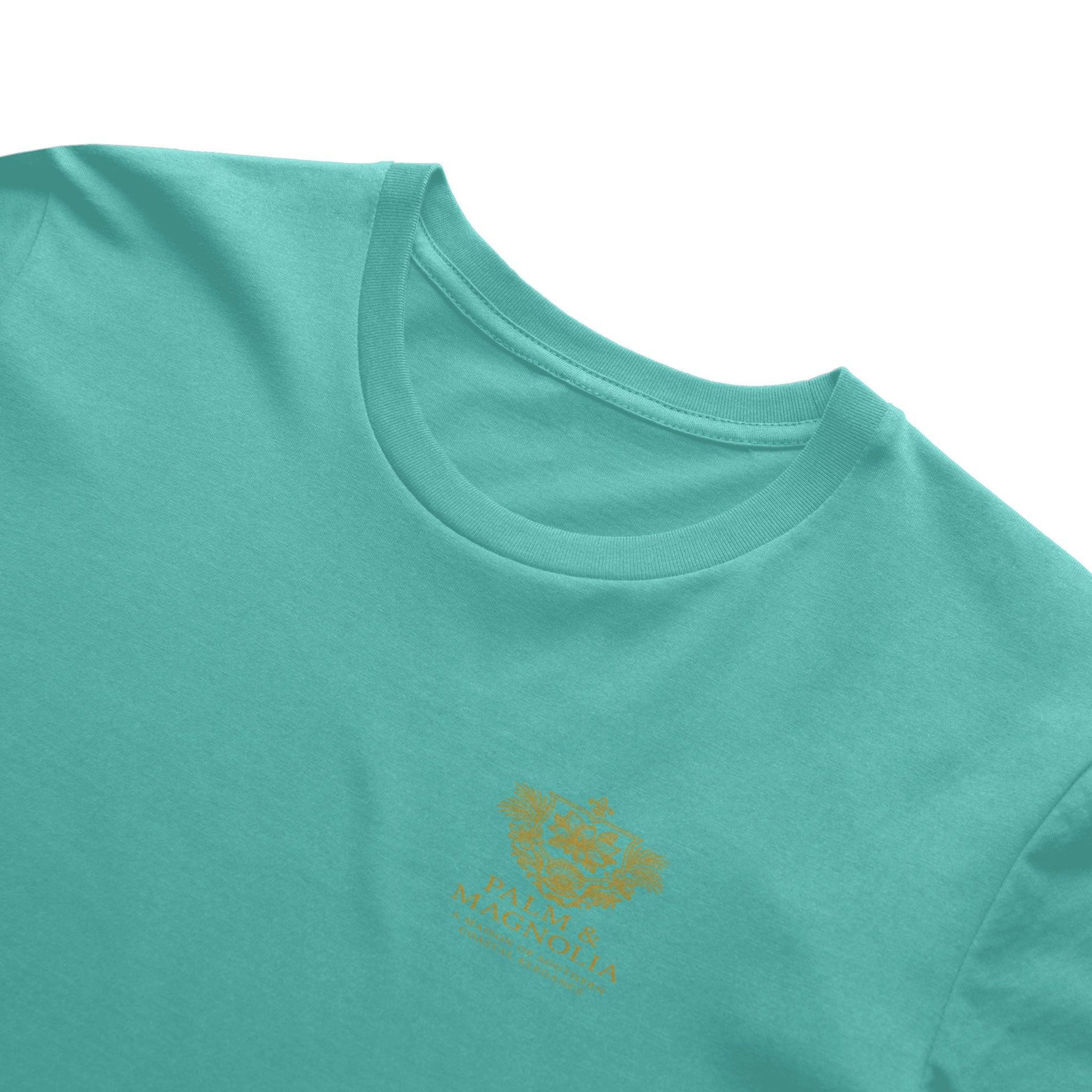 Teal Bella Canvas T-shirt with gold magnolia blossom embroidery.