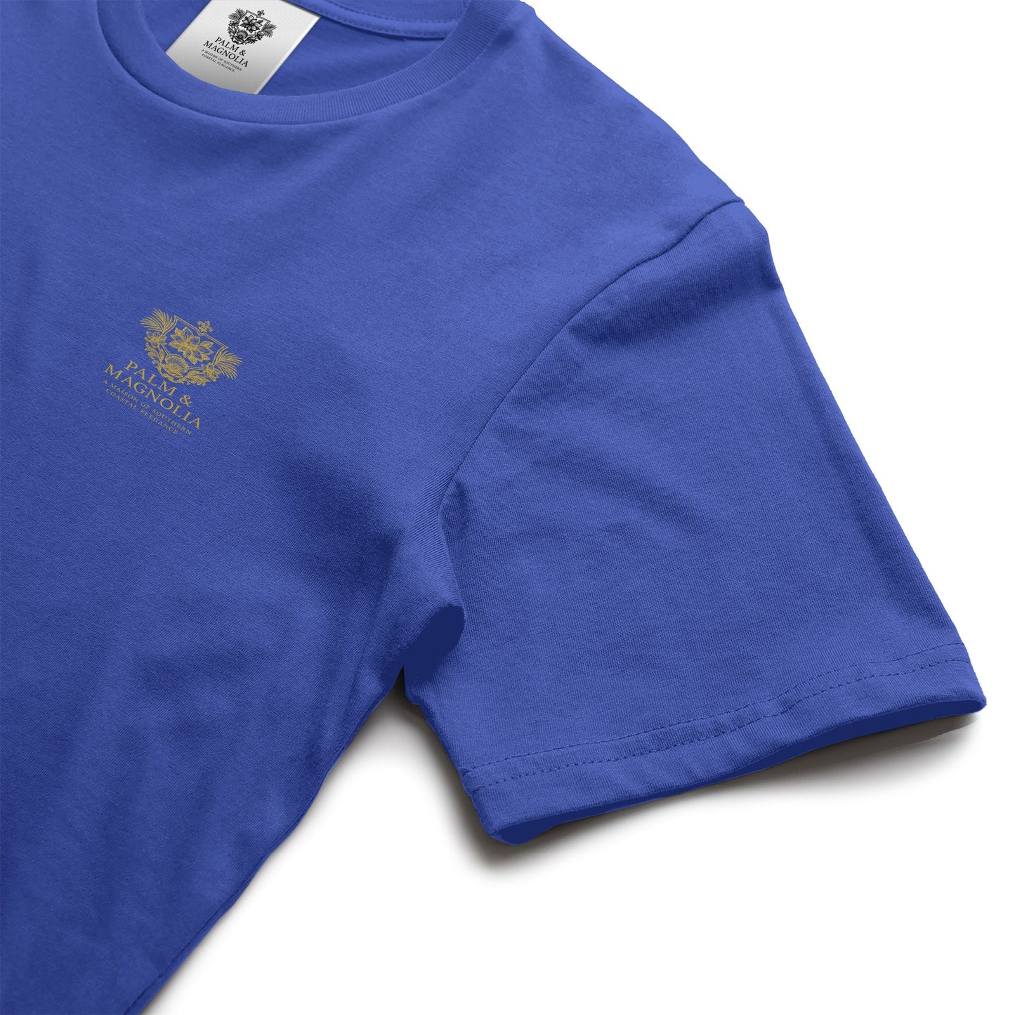 Navy blue unisex ring-spun cotton tee with gold Ocean Springs Serenity logo on chest.