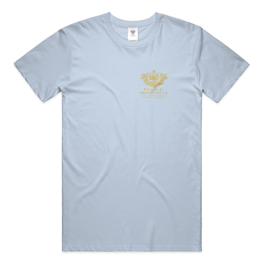 Light blue unisex ring-spun cotton tee with gold Palm & Magnolia crest.