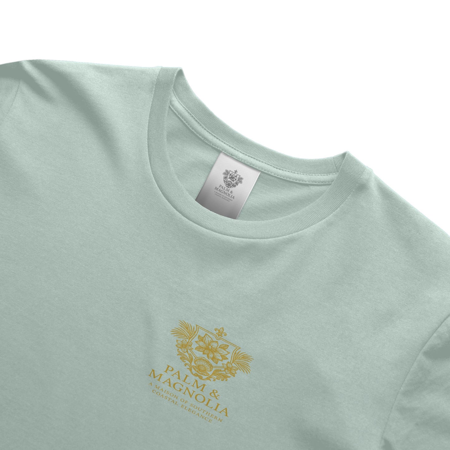 Light green unisex ring-spun cotton tee with gold Palm & Magnolia crest.