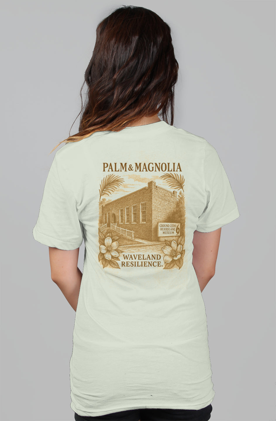 Back view of a light gray women's relaxed tee with Waveland Resilience print.