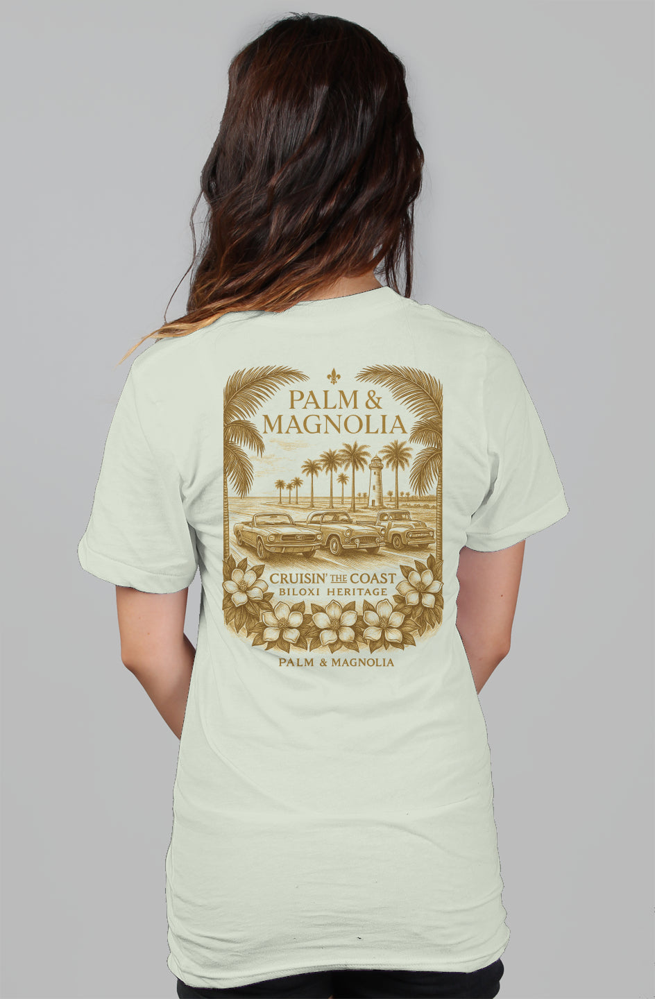 Back view of a light gray women's relaxed tee with gold Palm & Magnolia coastal print.