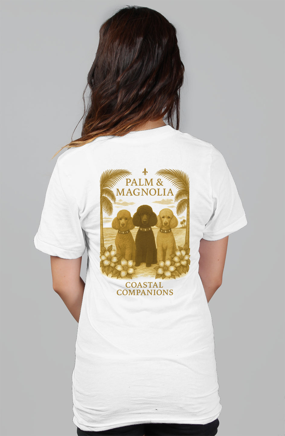 White women's relaxed tee with back print of three poodles framed by palms and magnolias.