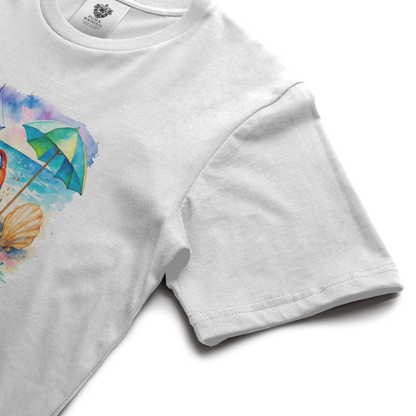 White unisex cotton t-shirt with front print of colorful beach umbrella, seashell, and sunny rays.