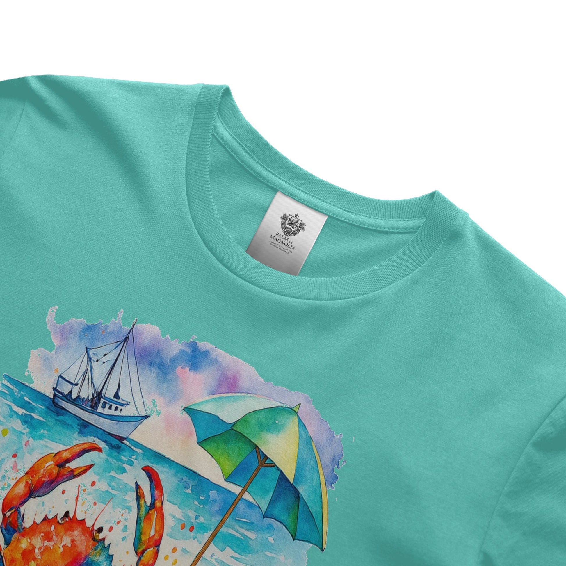 Teal unisex cotton t-shirt with watercolor crab, sailboat, and beach umbrella print.