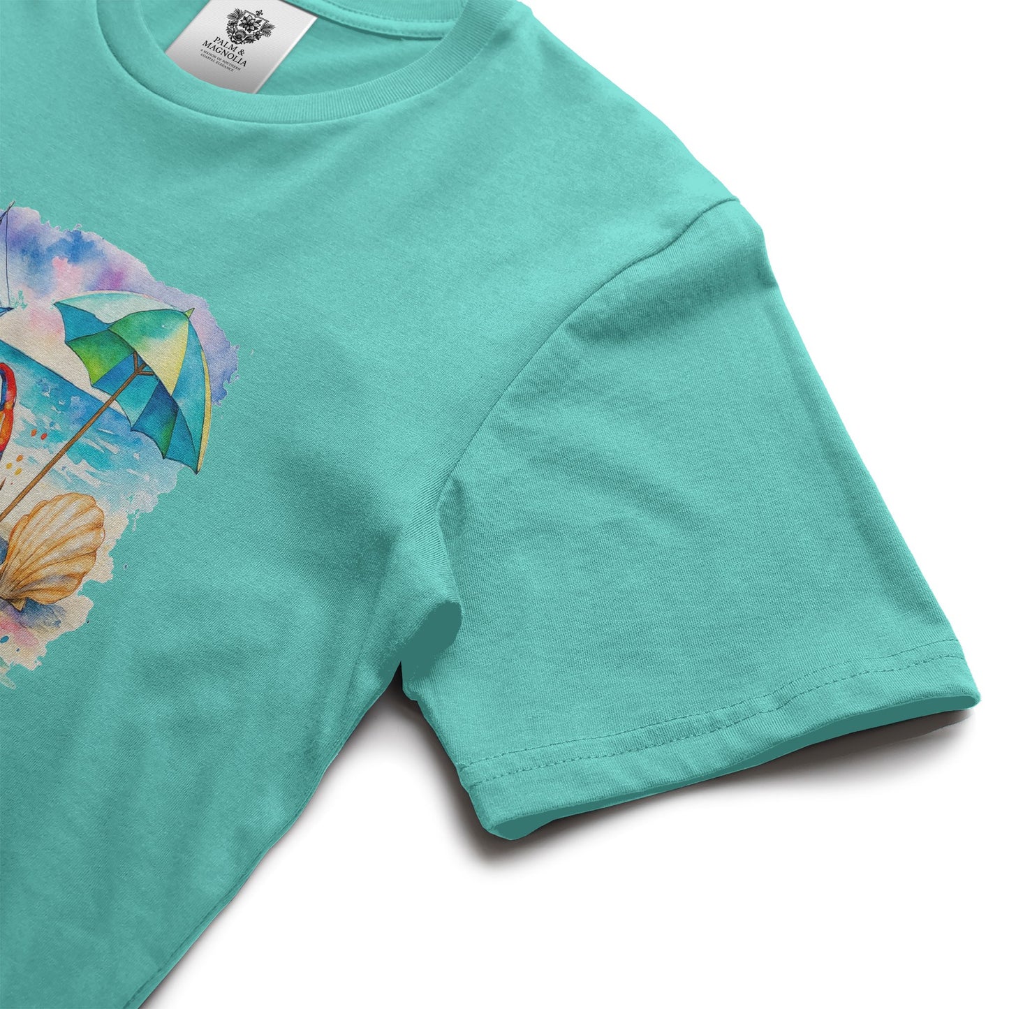 Turquoise unisex cotton tee with front print of beach umbrella, seashell, and sunny rays.