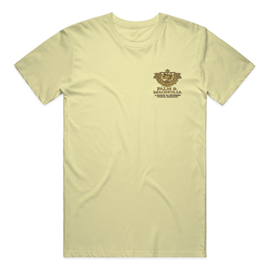 Yellow Comfort Colors heavyweight T-shirt with gold Palm & Magnolia emblem on chest.