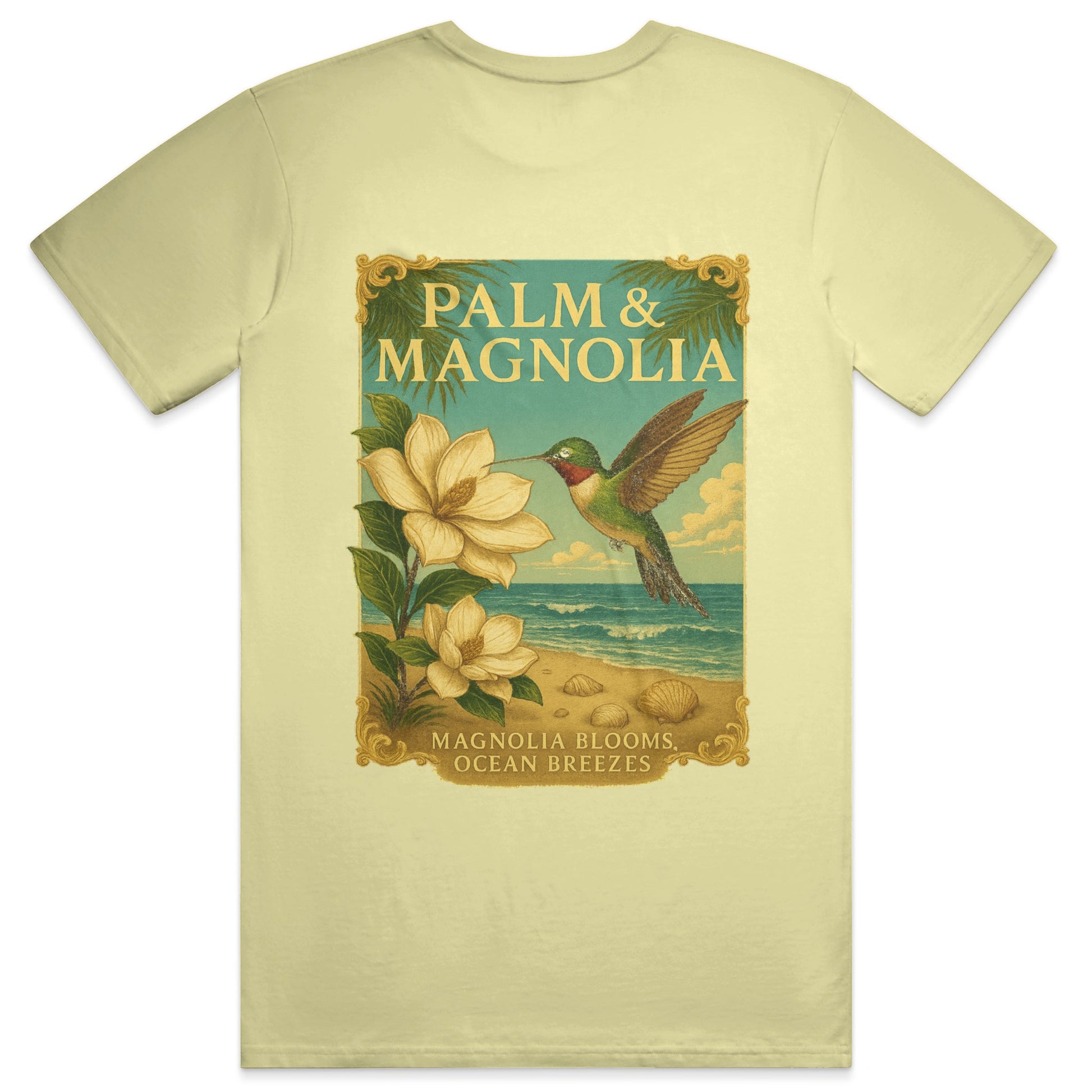 Yellow Comfort Colors T-shirt with vintage-style print of hummingbird, magnolia blooms, palm leaves, beach, and ocean.