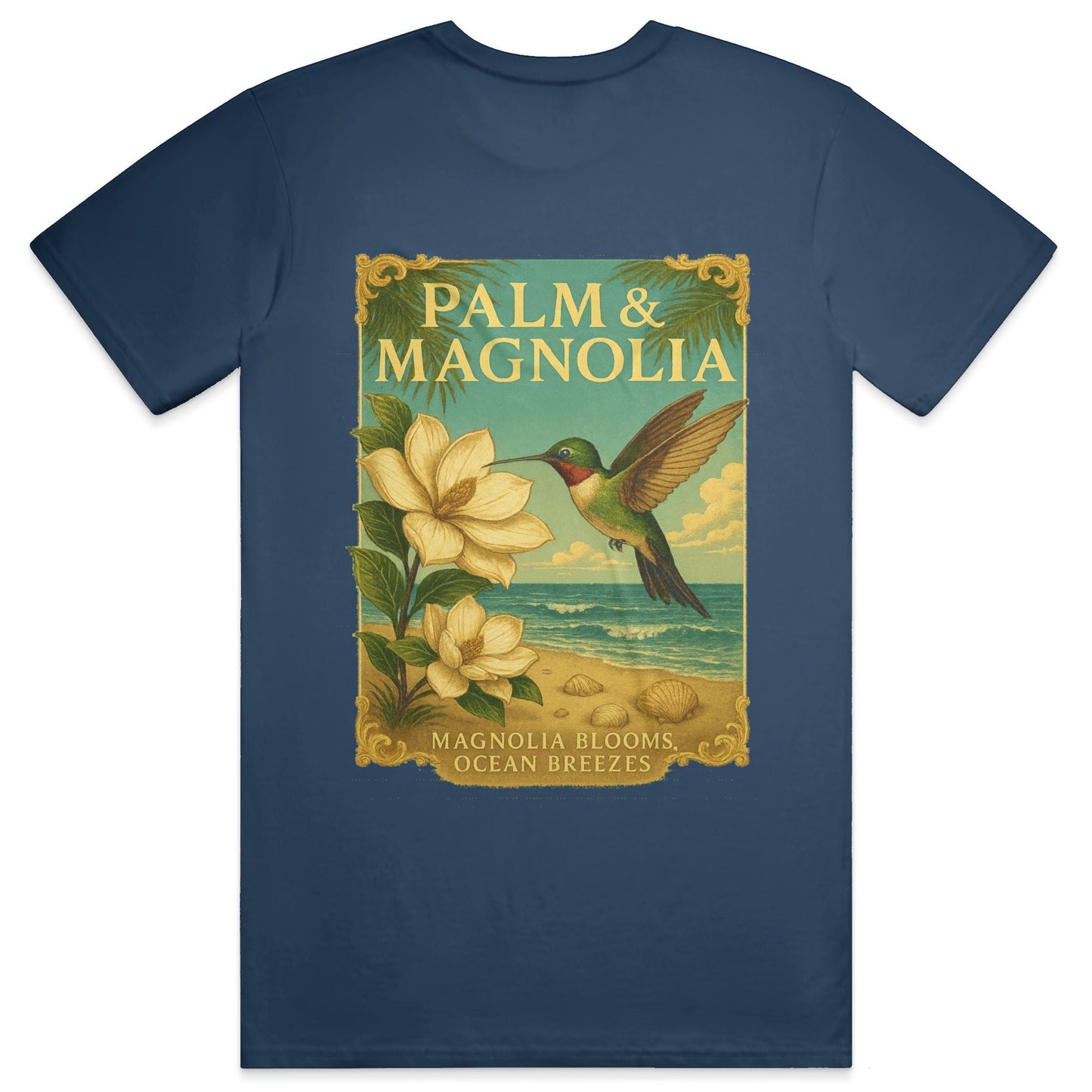 Navy blue Palm & Magnolia tee with vintage poster of hummingbird, magnolia blooms, and ocean scene.