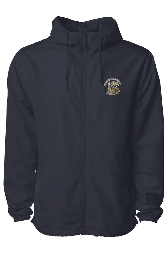 Black lightweight water-resistant windbreaker with Palm & Magnolia logo on chest.