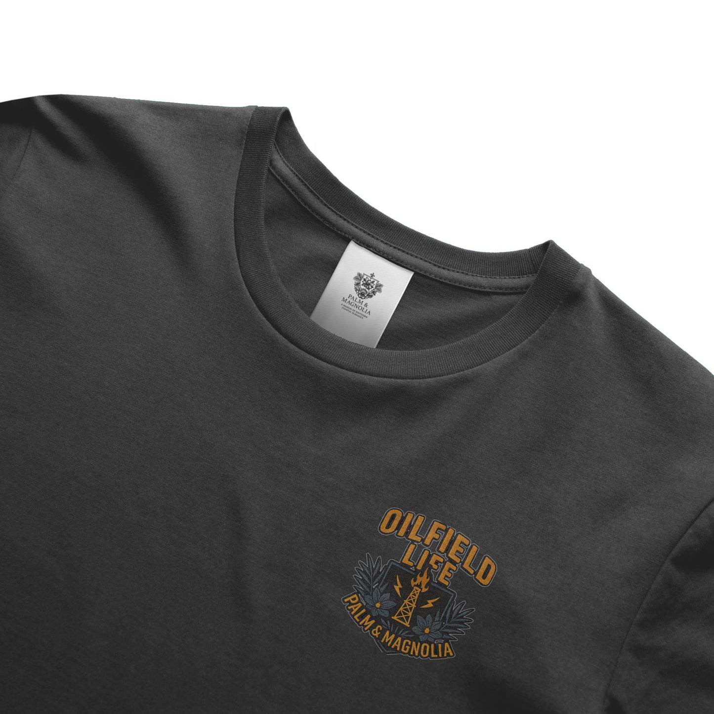 Gray heavyweight cotton tee with "Oilfield Life Palm & Magnolia" embroidery.