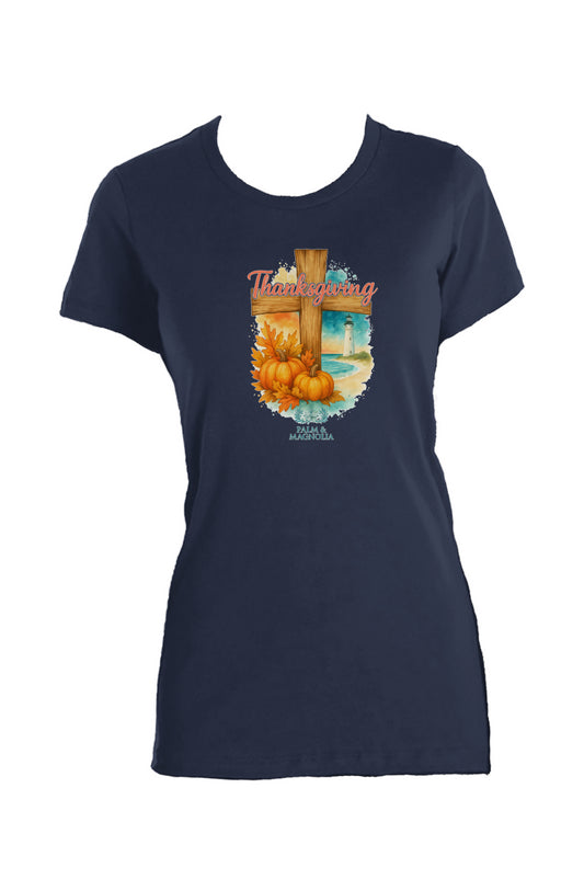 Navy women's crew t-shirt with coastal Thanksgiving print of cross, pumpkins, and lighthouse.