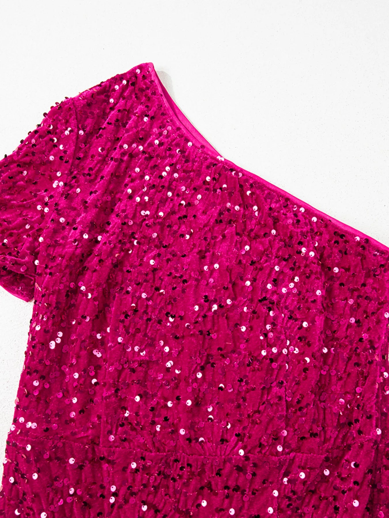 One-shoulder sequin dress with high slit in soft cotton spandex blend fabric.