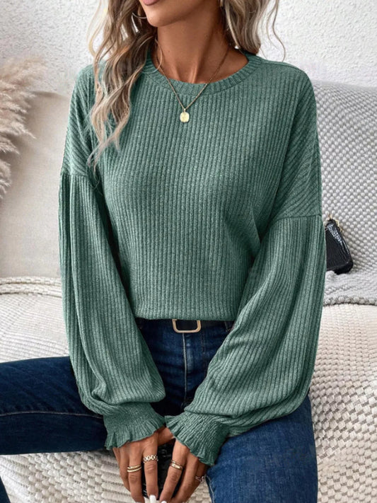Ribbed knit long sleeve t-shirt in black with stretchy polyester blend fabric.