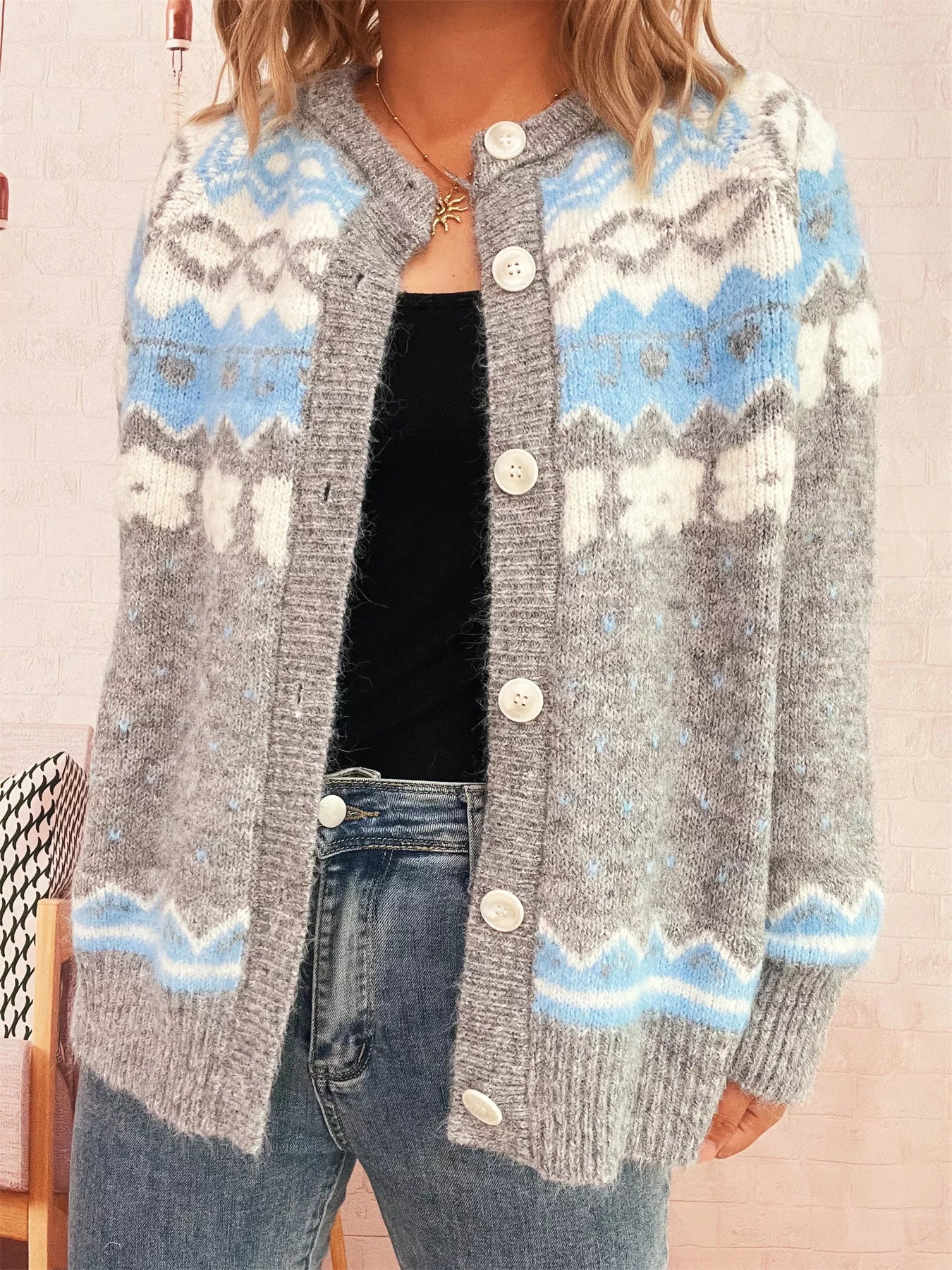 Ribbed button-down cardigan in stretchy polyester with long sleeves and a relaxed fit.
