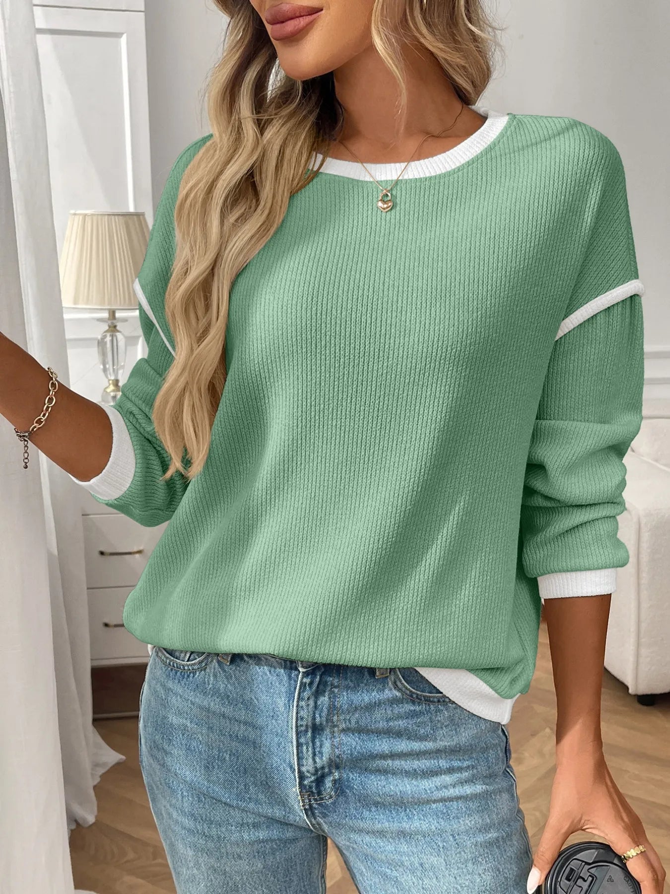 Ribbed long sleeve top with contrast trim, made from stretch fabric for comfort and fit.