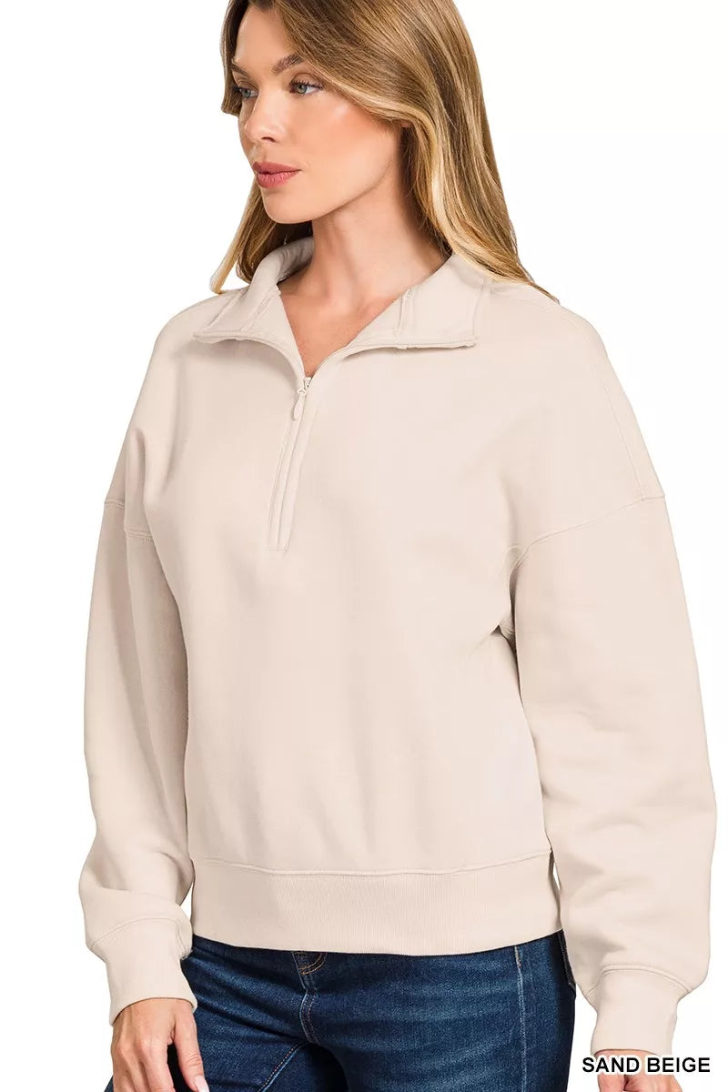 Sand beige half-zip sweatshirt with high neck collar and ribbed cuffs for a relaxed fit.