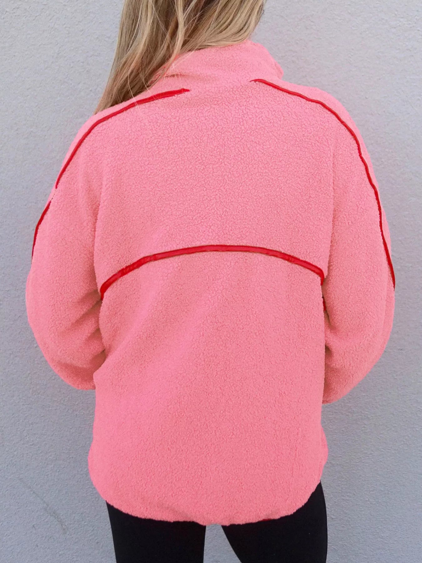 Half zip sweatshirt in sherpa fabric with faux leather trim and front pocket.