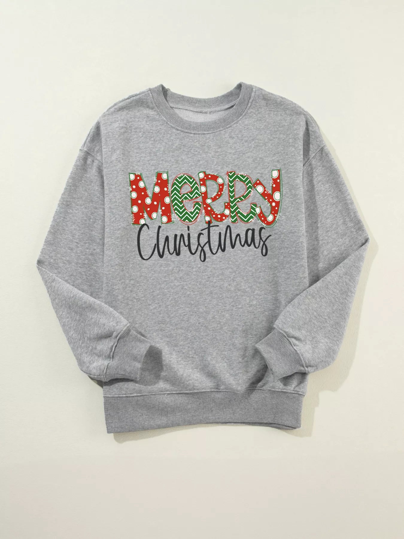 Sweatshirt en mezcla de algodón con hombros caídos y estampado de letras festivas.