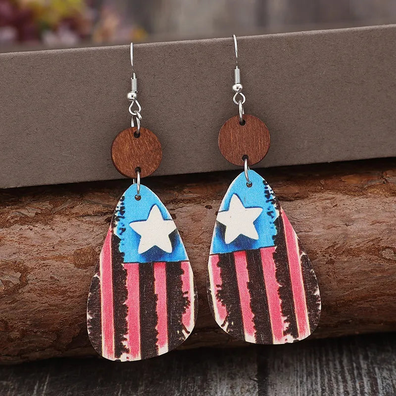Wooden dangle earrings with star and stripes design in alloy and wood materials