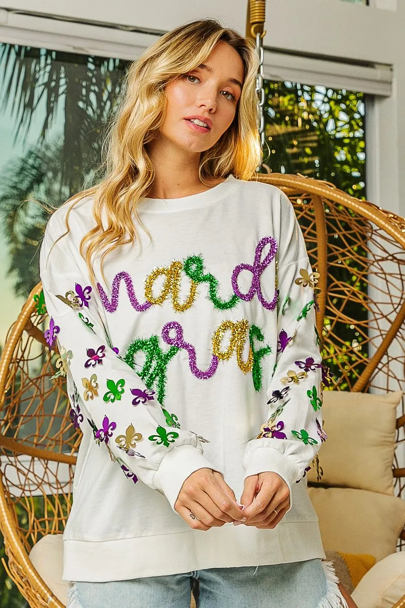 Lightweight pullover with Fleur De Lis sleeve designs in soft-washed fabric for comfort.