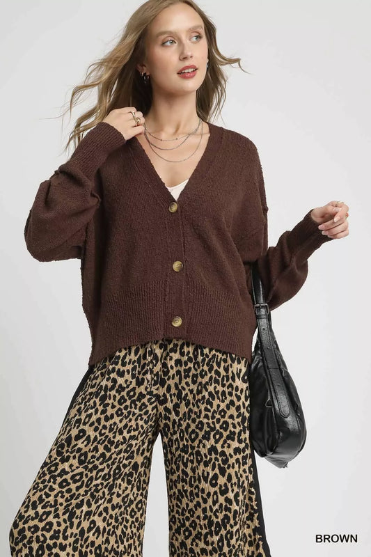 Woman modeling hemlock brown button-front V-neck knit cardigan.