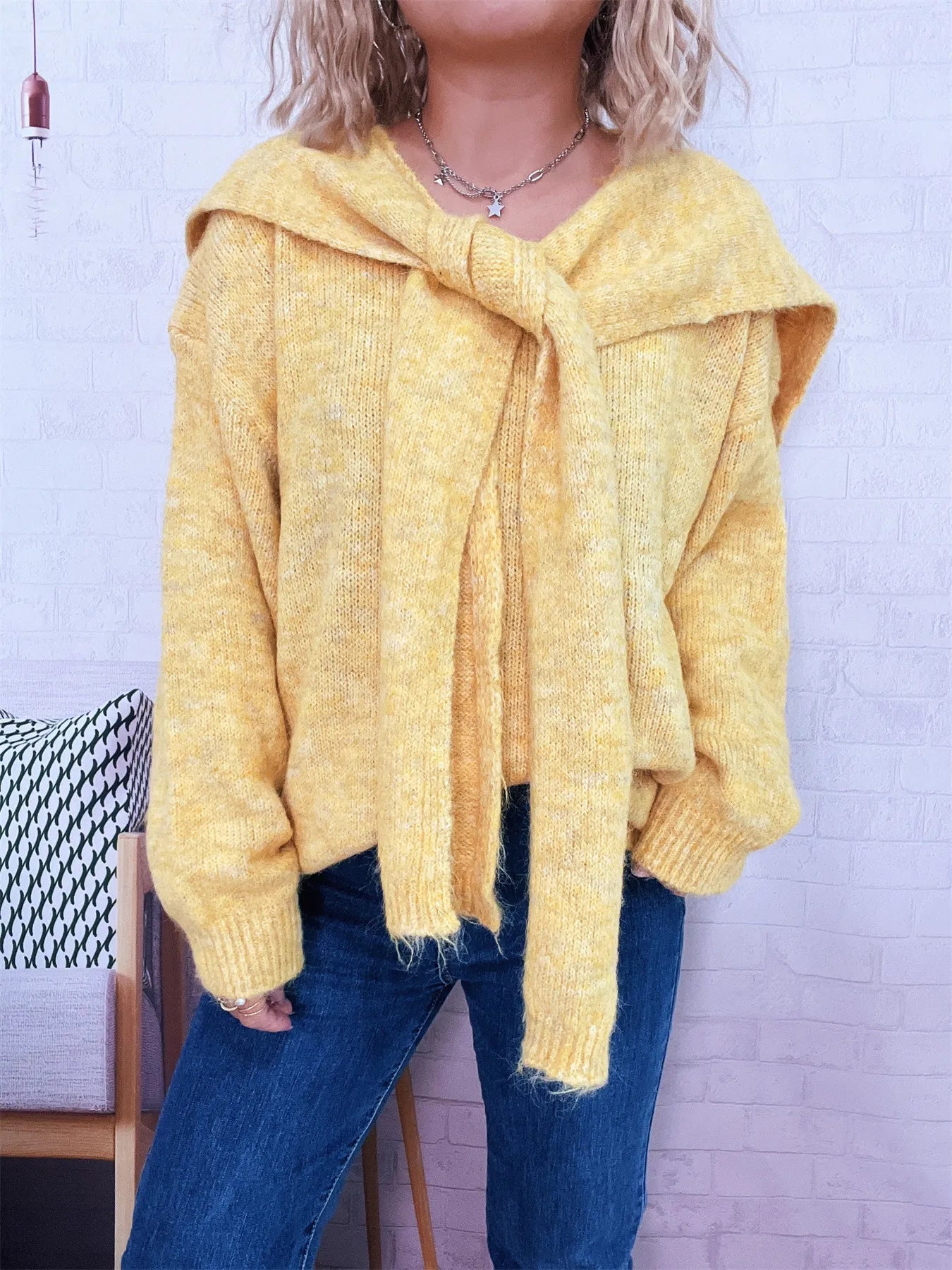 Ribbed hem V-neck sweater with shawl, slightly stretchy, in soft polyester fabric.