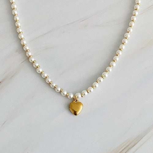 Pearl and gold bauble heart necklace with alternating beads and a golden heart charm.