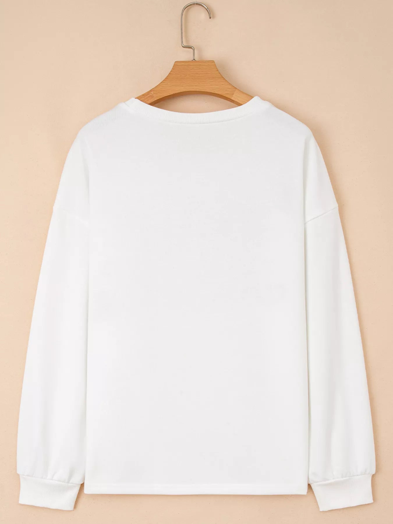 Round neck sweatshirt with Holly Jolly embroidery in polyester cotton blend fabric.