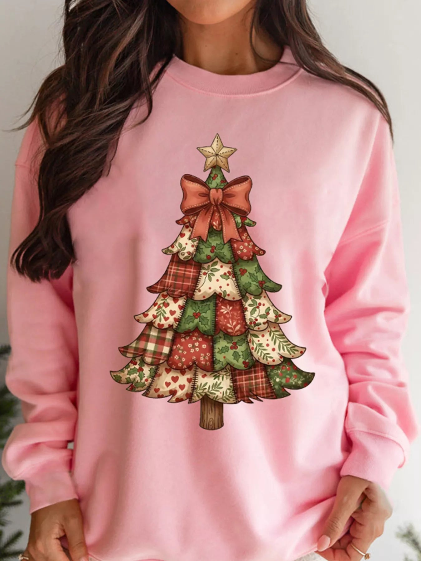 Long sleeve sweatshirt with a Christmas tree graphic in a polyester cotton blend fabric