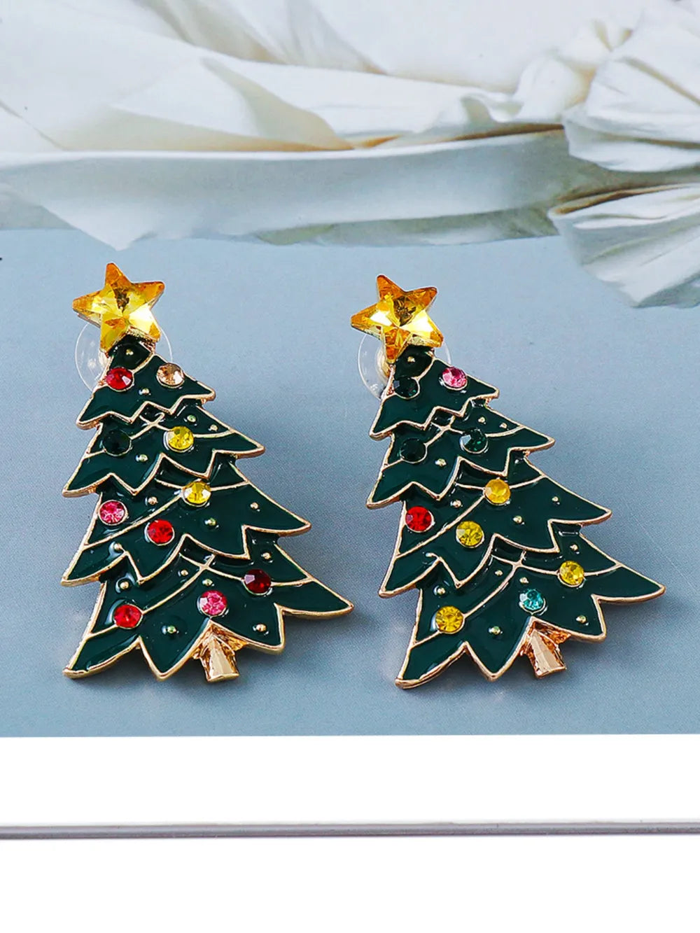 Pair of green alloy Christmas tree earrings inlaid with colorful rhinestones.
