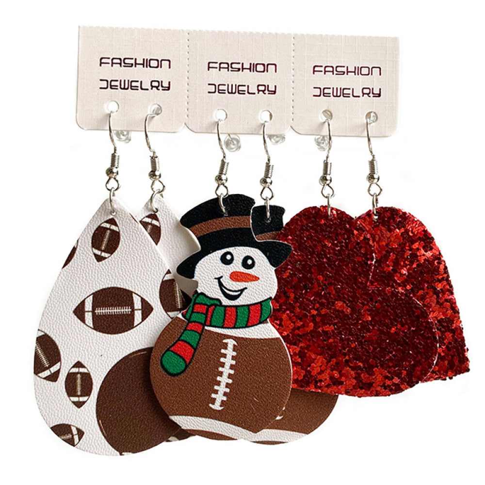 Set of iron charm earrings with snowman, football, and heart designs.