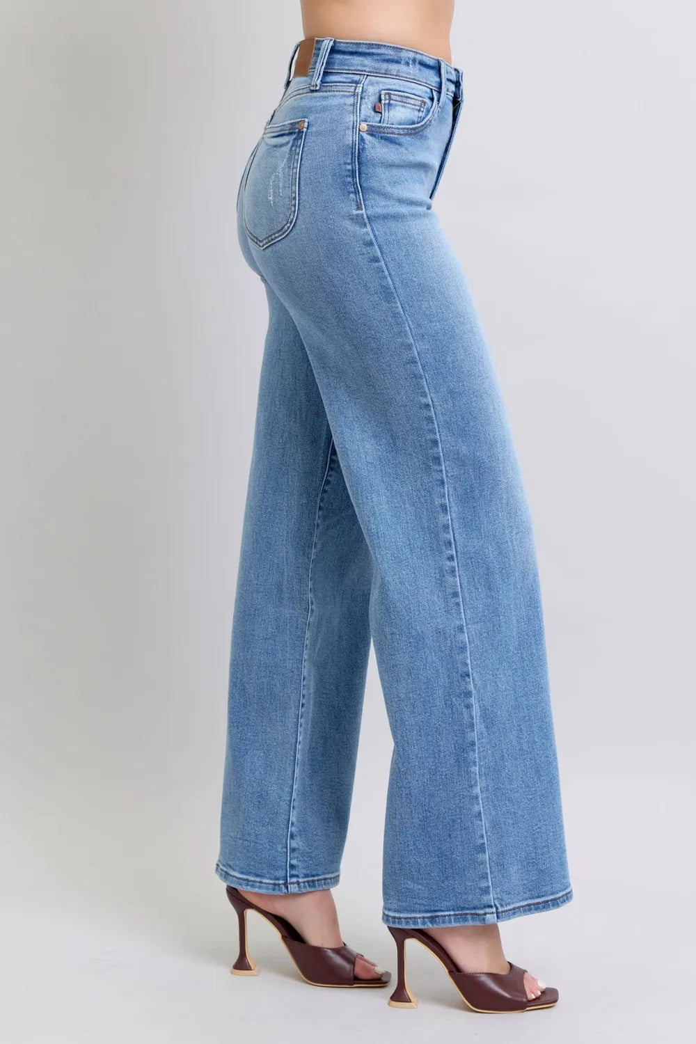 Side view of Judy Blue high-waist wide-leg jeans with pockets, modeled on a figure.