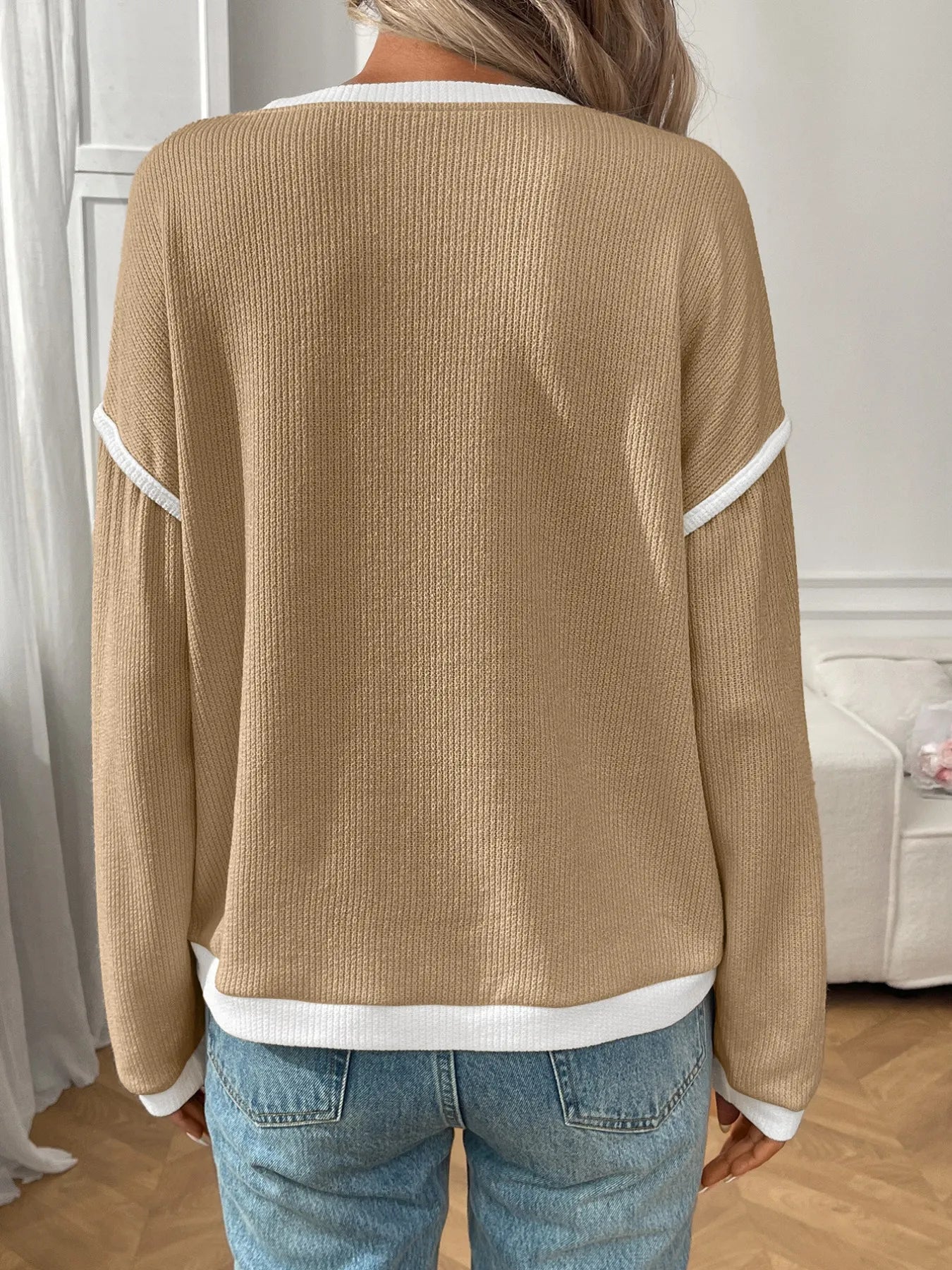 Ribbed long sleeve top with contrast trim and stretch fabric in a fitted silhouette.