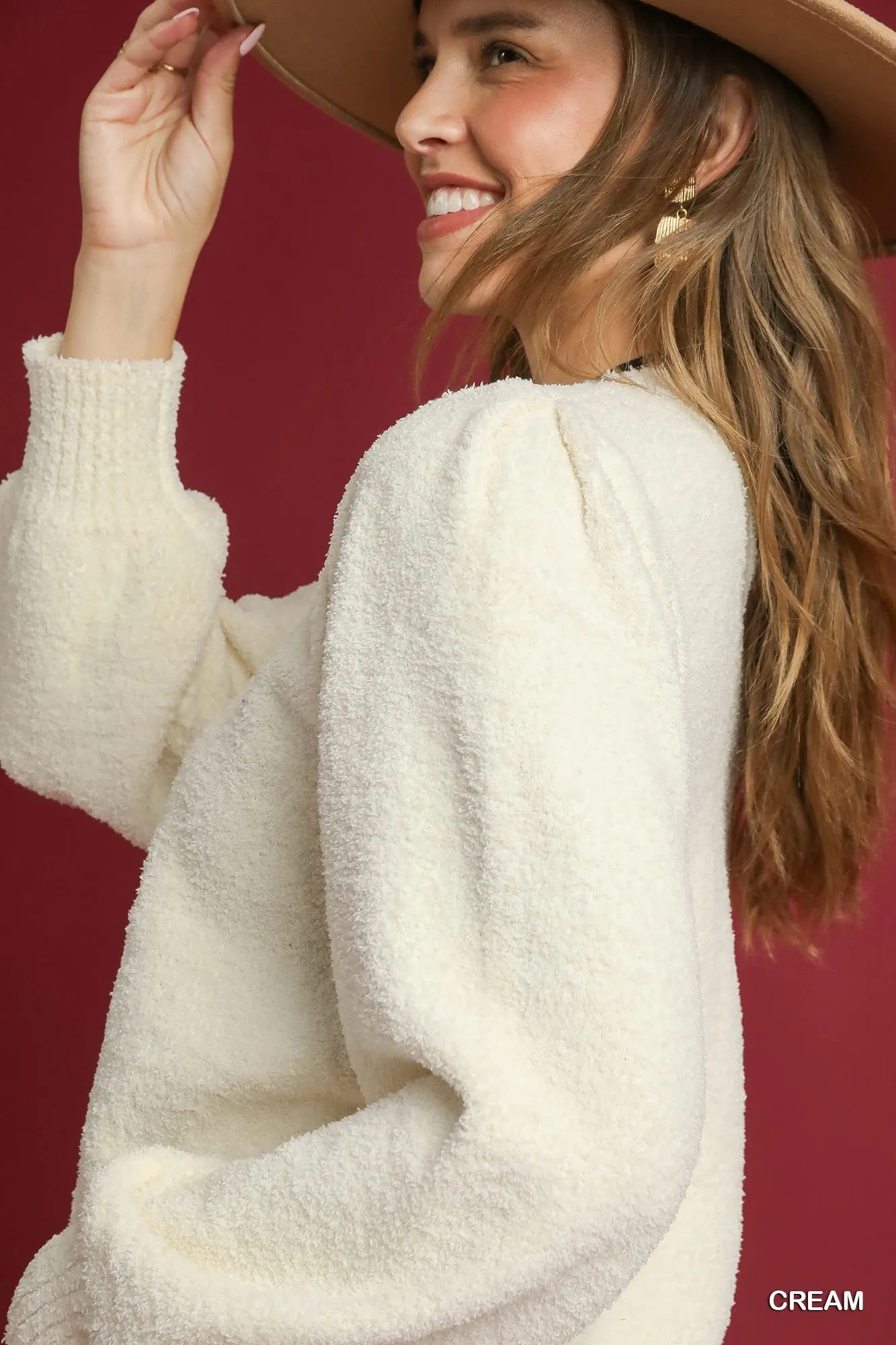 Textured long sleeve acrylic sweater with ribbed trim, shown on model.