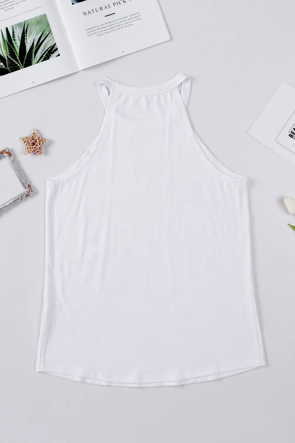 Sheer tank top with sequins featuring a US flag design and Grecian neckline.