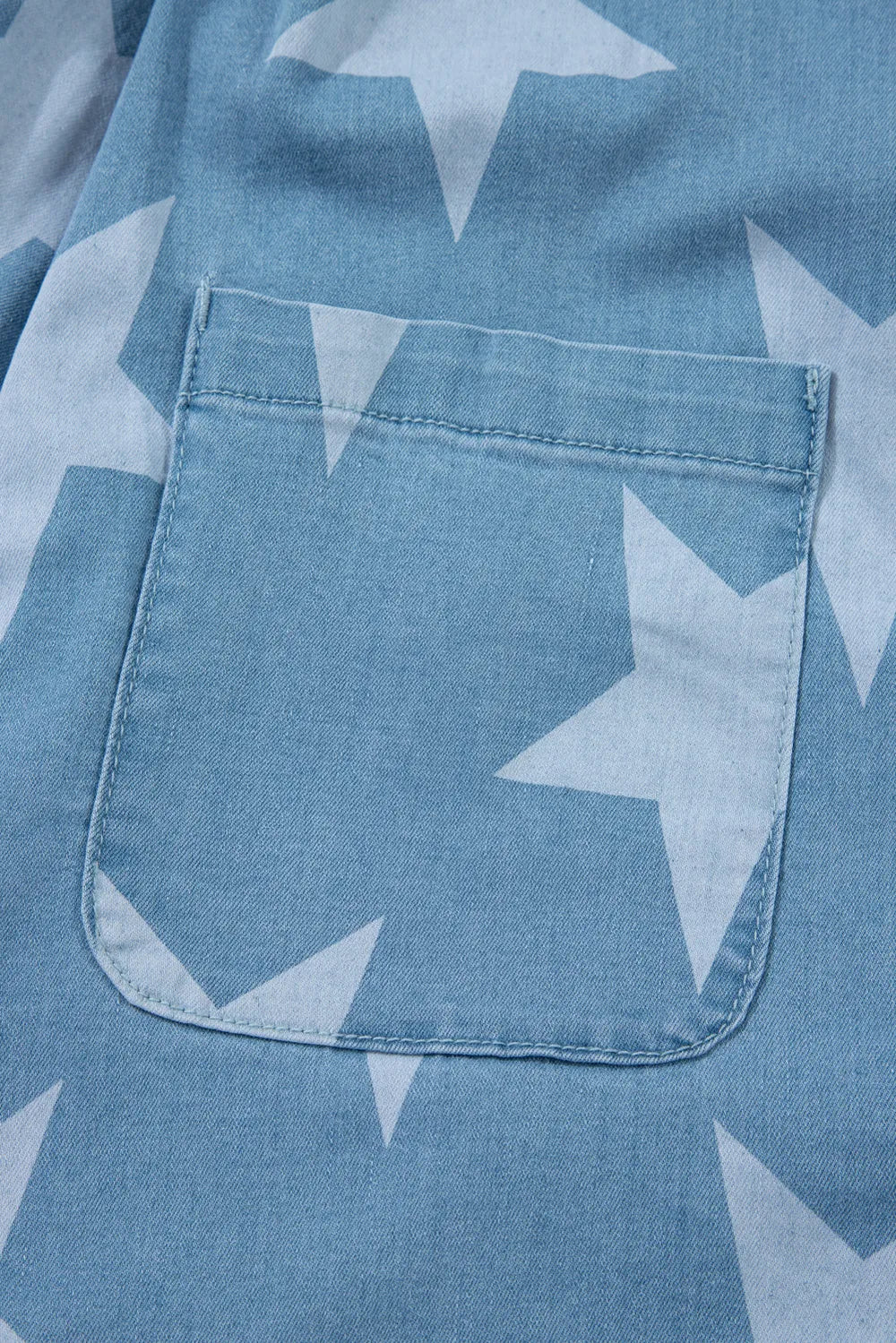 Denim overalls with star print, square neck, made of cotton blend fabric.