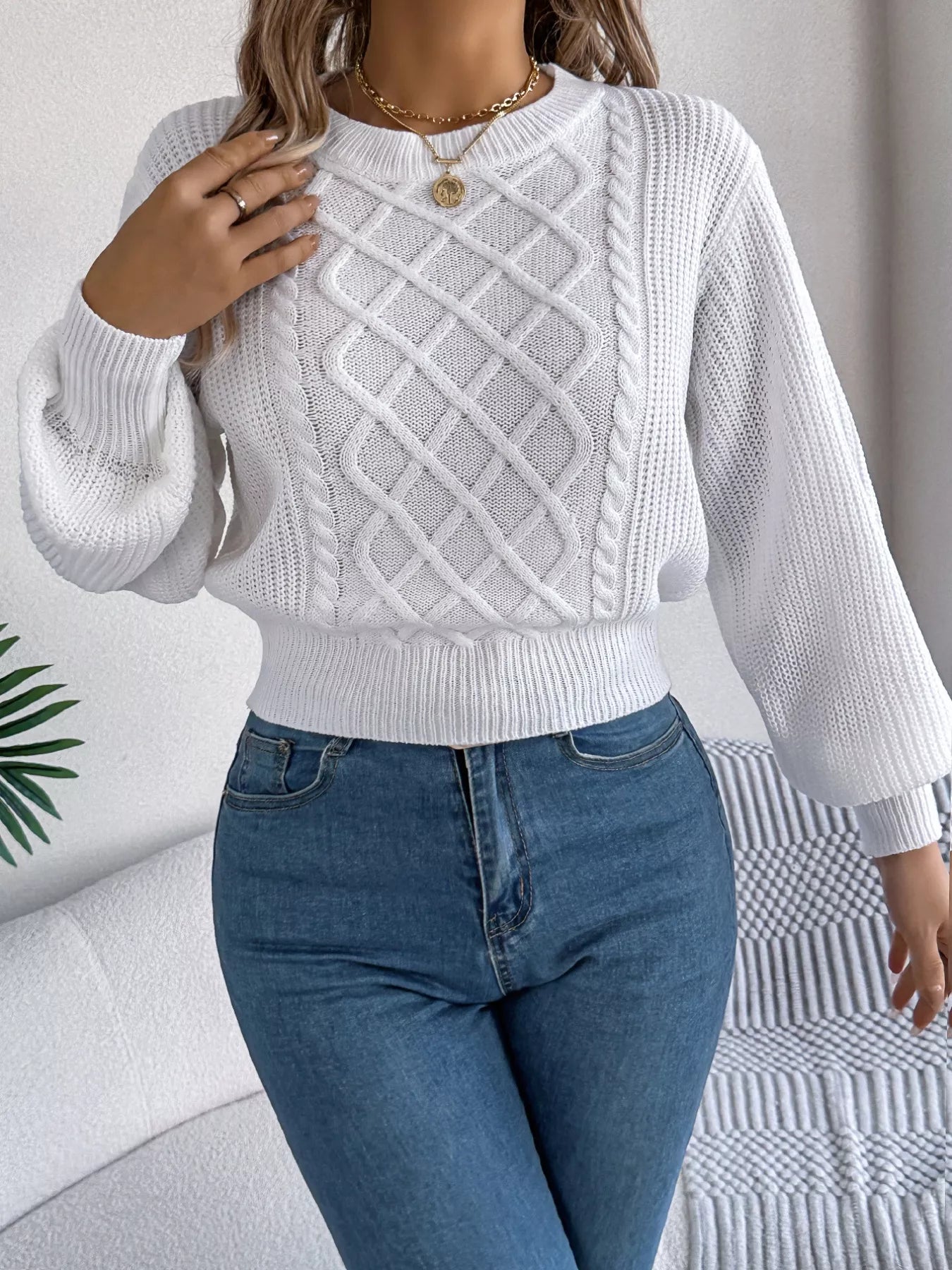 Long sleeve acrylic sweater with cable knit diamond pattern and stretchy fit in neutral color
