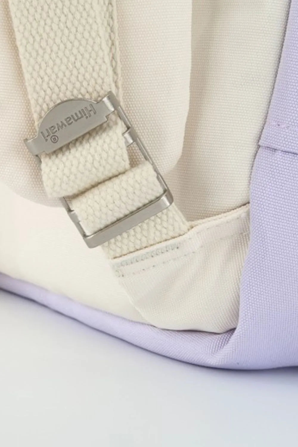 Himawari water-resistant nylon backpack in cream and purple with contrast panels.