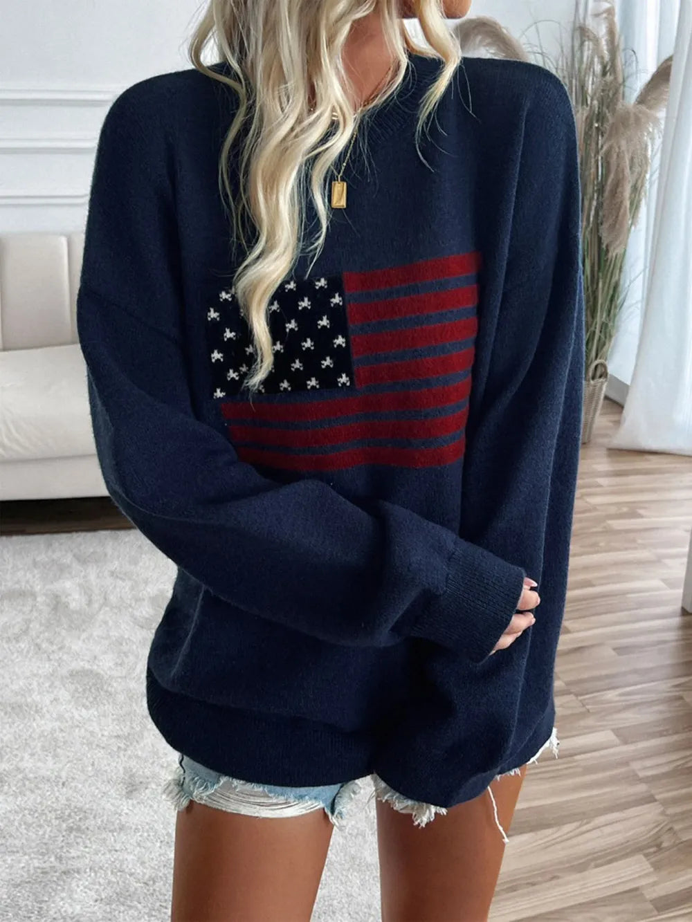 Long sleeve round neck knit top featuring the US flag design in an acrylic blend.
