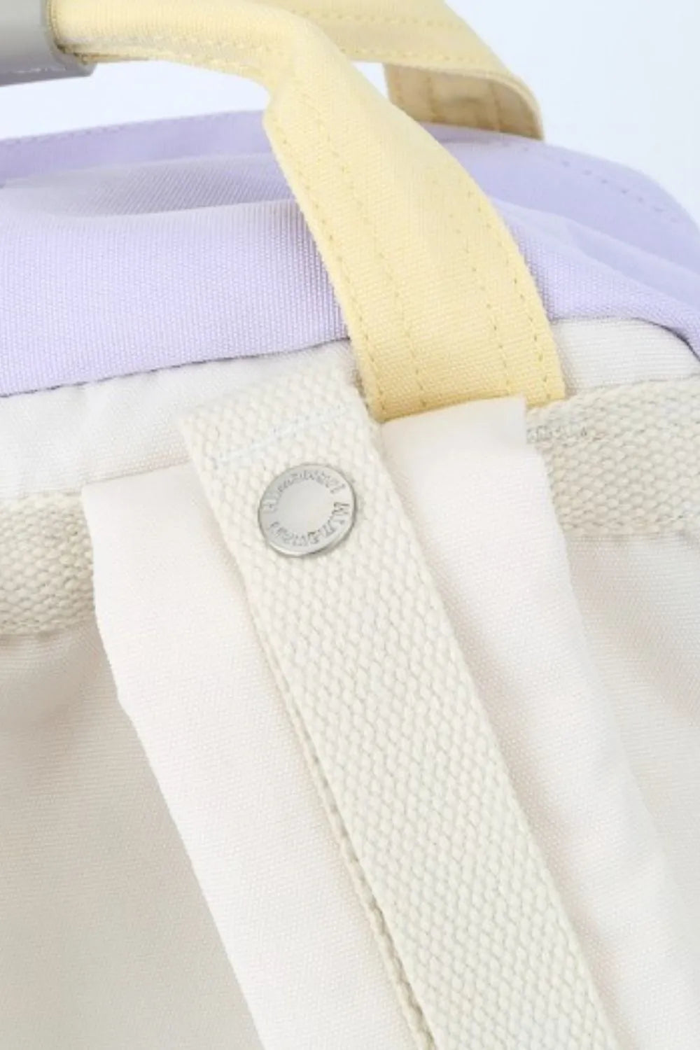 Purple and yellow water-resistant nylon backpack with contrast straps and metal zipper.