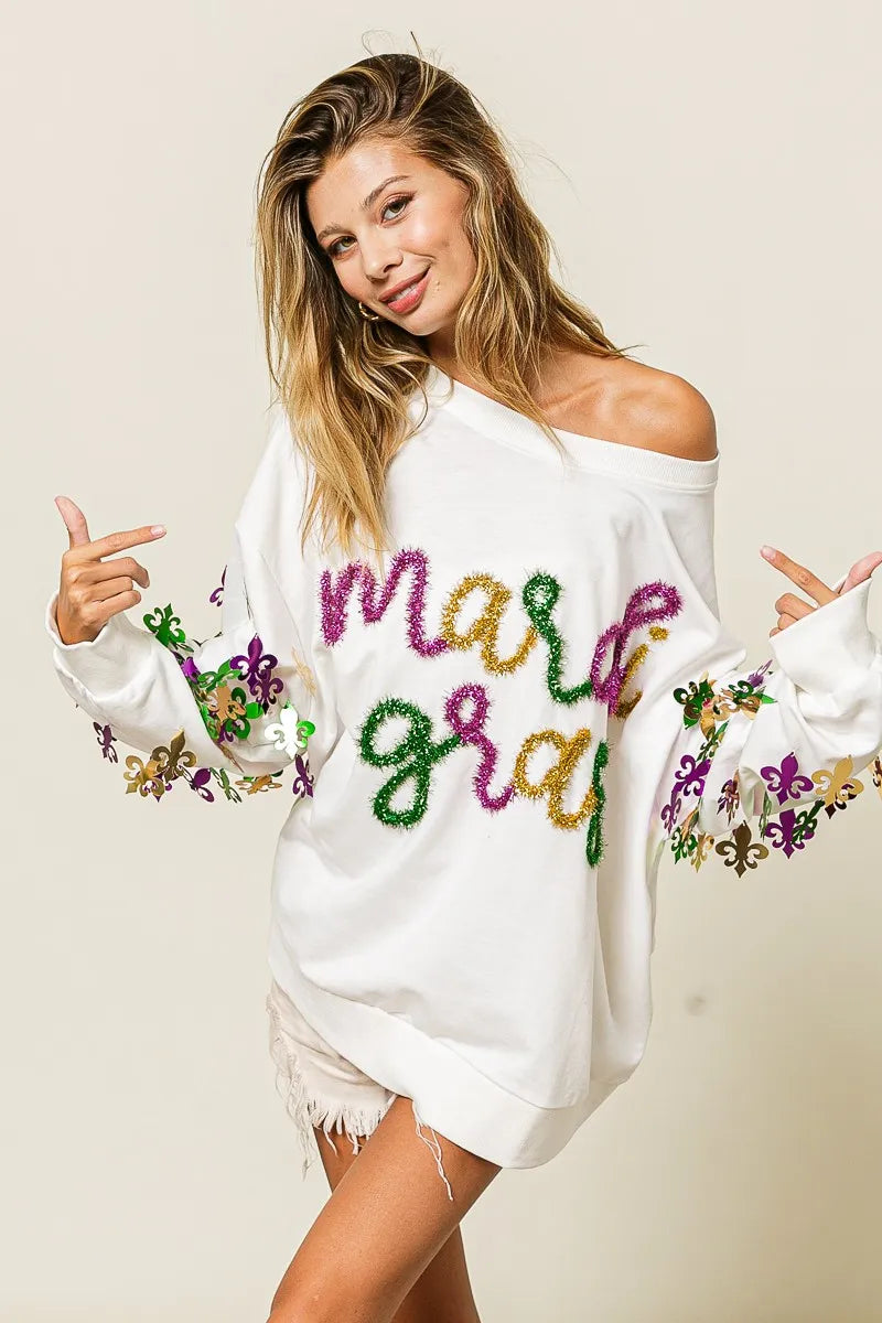 Lightweight pullover with Fleur De Lis sleeve designs in soft-washed fabric for comfort.