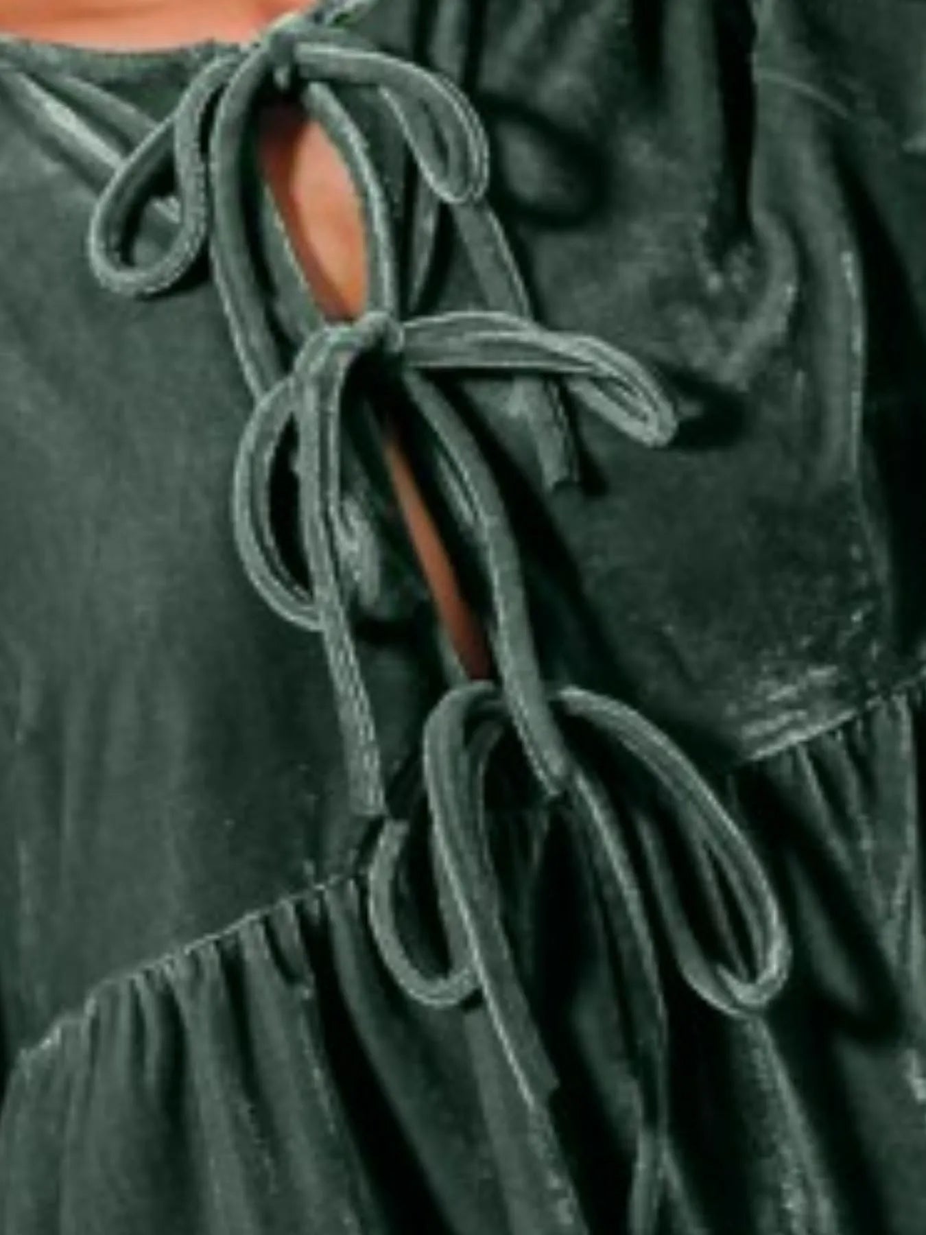 Emerald green velvet peasant blouse with tie-front neckline and balloon sleeves.